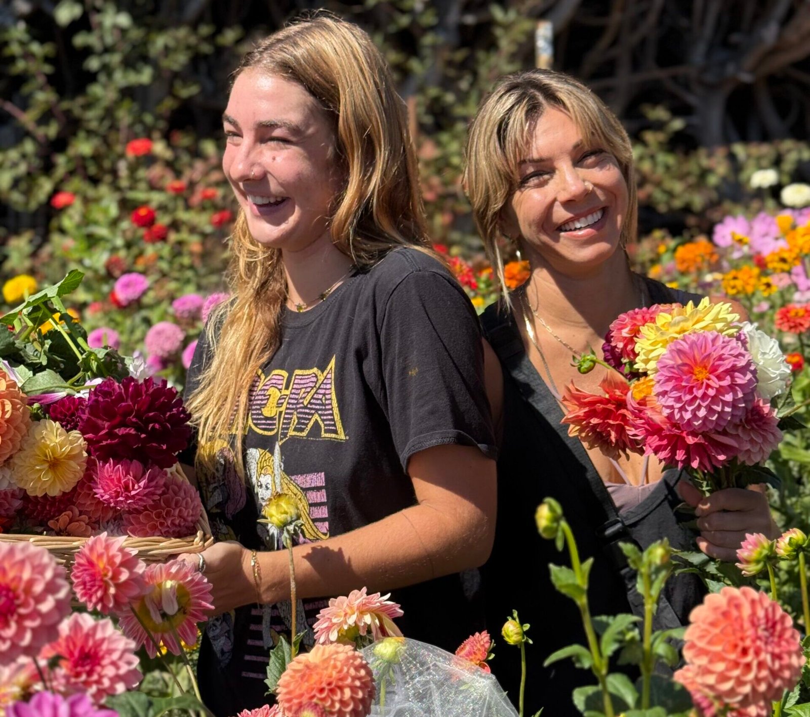 Guests at Dynomite Farm with bouquets of dahlias