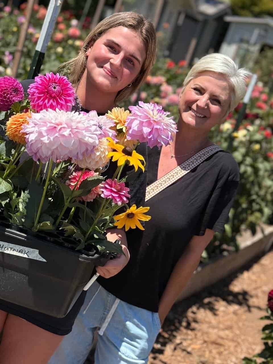 Bianca and Sasha with flowers at Dynomite Farm