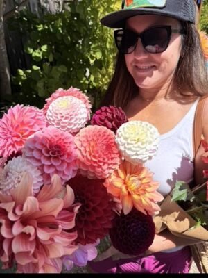 pick your own flowers Santa Cruz, woman with dahlia bouquet at Dynomite Farm